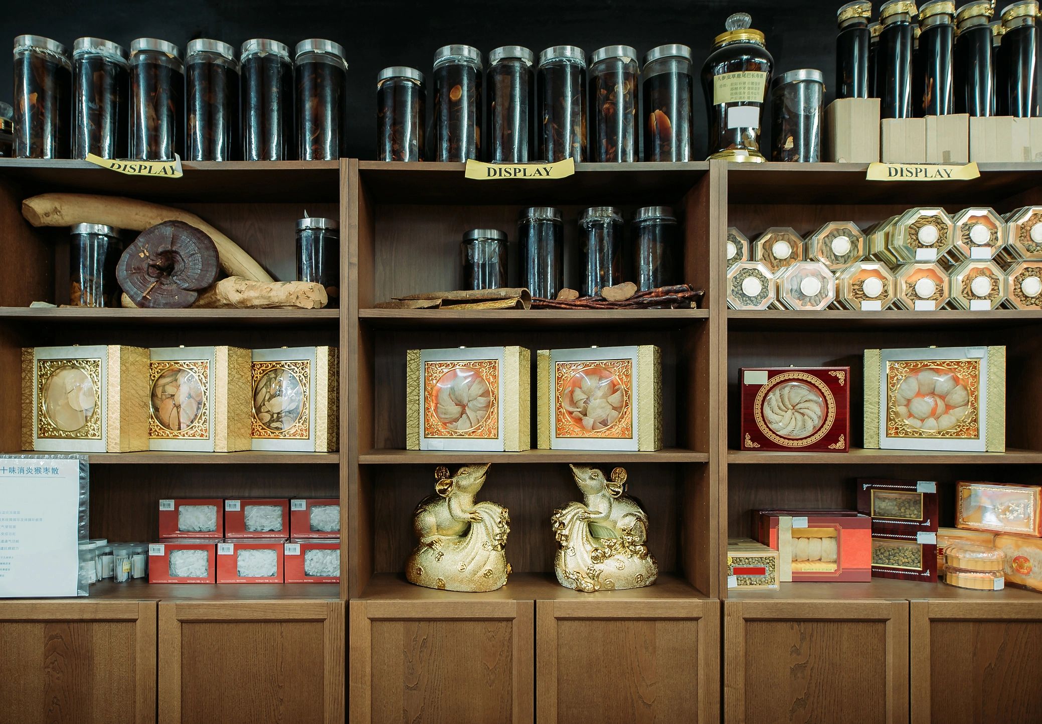 Cabinet with labeled drawers suggesting curated storage