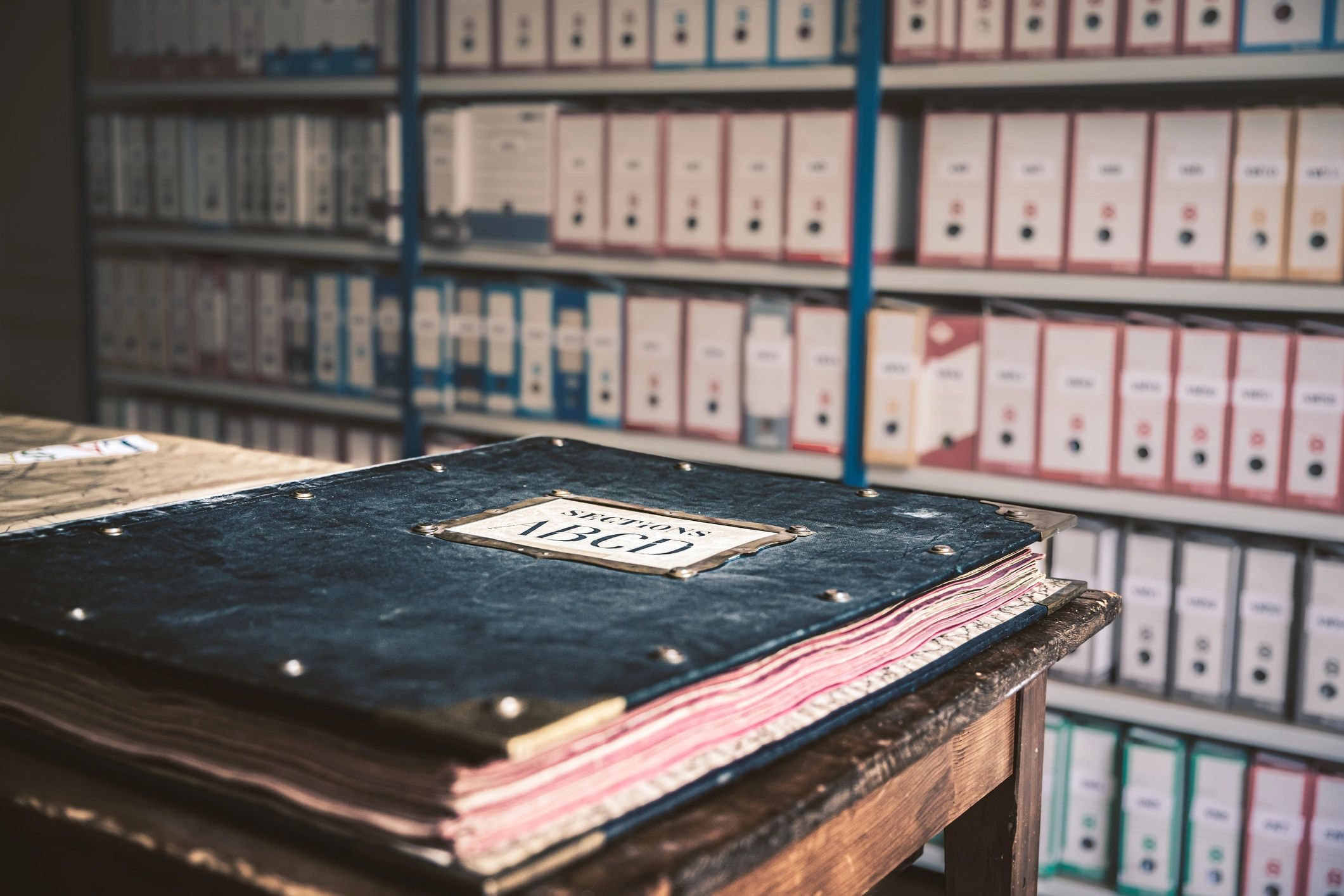 Archival reading table with historic books and finding aids