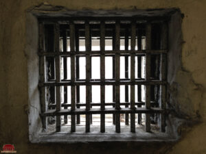 Historic jail bars inside the Old Stone Jail